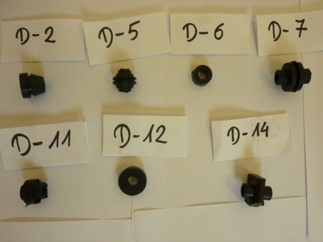 Elementy o następujących symbolach identyfikacyjnych: „D-2”, „D-5”, „D-6”, „D-7”, „D-11”, „D-12”, „D-14”, wykonane są w całości z gumy, na wtryskarkach lub metodą prasowania na prasach hydraulicznych z grzanymi półkami. Wszystkie wyroby mają wewnętrzny okrągły otwór przelotowy o średnicy około 1 cm. Na zewnątrz mogą być gładkie lub posiadać specjalnie wyprofilowane kołnierze, rowki obwodowe itp. Ich gabarytowe wymiary wynoszą od około 1 cm do 4 cm. Towary są przeznaczone do zastosowania w samochodowych elastycznych przewodach hamulcowych, służą jako odbój lub element mocujący przewodu hamulcowego.