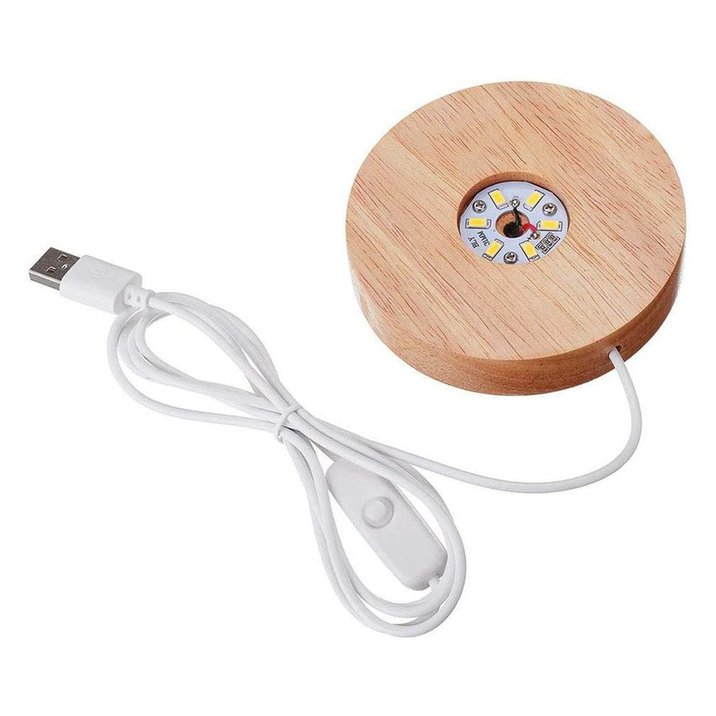Podstawa do lampy w kształcie koła, wykonana z drewna. W środku podstawy zamocowana okrągła płytka PCB ze źródłem światła. Wyposażona w przewód z wyłącznikiem, zakończony gniazdem USB. Występuje w dwóch wersjach: z jednokolorowymi diodami LED lub wielokolorowymi diodami LED, z pilotem na podczerwień. Prezentowana bez dodatkowej obudowy dolnej i klosza górnego (nie objętych wnioskiem). Napięcie 5V.