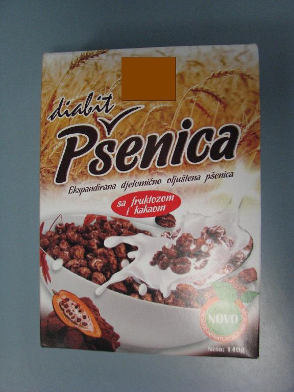 Živilo, dobljeno z nabrekanjem delno oluščenih pšeničnih zrn, z dodatkom fruktoze in kakava v prahu (manj kot 6 mas. %) v obliki ekspandiranih zrn rjave barve.

Uporablja se za prehrano.

Pakirano v vrečko in nato v kartonsko škatlo po 140 g.